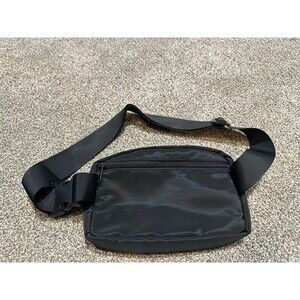 Black belt bag with gold zipper